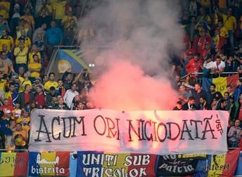 epa05377852 Supporters of Romania light flares during the UEFA EURO 2016 group A preliminary round match between Romania and Albania at Stade de Lyon in Lyon, France, 19 June 2016. (RESTRICTIONS APPLY: For editorial news reporting purposes only. Not used for commercial or marketing purposes without prior written approval of UEFA. Images must appear as still images and must not emulate match action video footage. Photographs published in online publications (whether via the Internet or otherwise) shall have an interval of at least 20 seconds between the posting.) EPA/CJ GUNTHER EDITORIAL USE ONLY