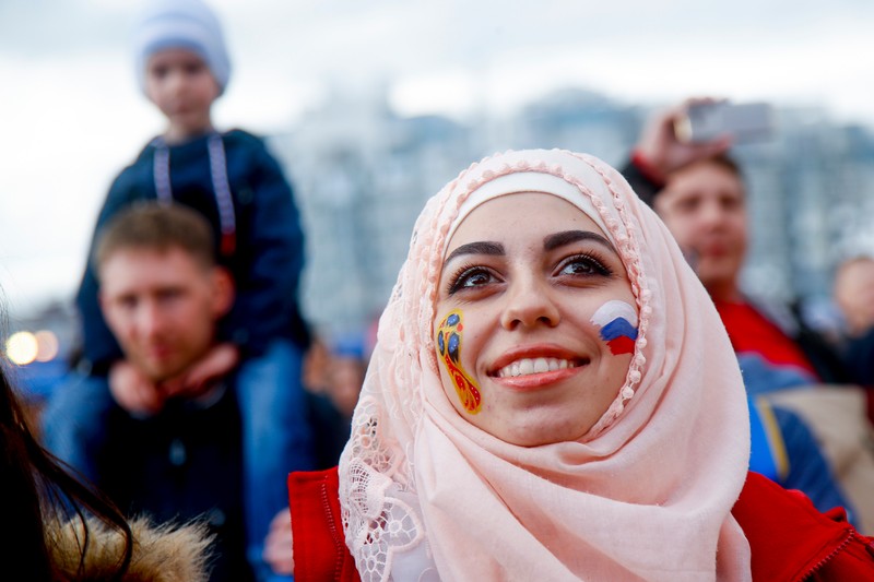 epa06807858 A Russian soccer fan watches performers on stage at the FIFA Fan Fest in Kazan, Russia, 14 June 2018. The FIFA World Cup 2018 will take place in Russia from 14 June until 15 July 2018. EPA-EFE/DIEGO AZUBEL
