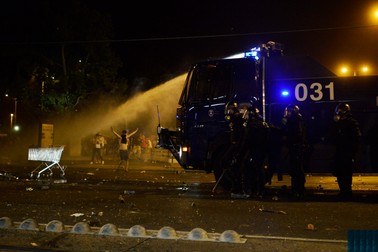 epa04913777 Hungarian riot police use water canon to disperse rioting soccer fans after the UEFA Euro 2016 qualifying Group F soccer match between Hungary and Romania in the Groupama Arena, Budapest, Hungary, 04 September 2015. EPA/JANOS MARJAI HUNGARY OUT