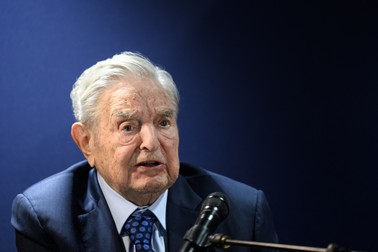 (FILES) Hungarian-born US investor and philanthropist George Soros answers to questions after delivering a speech on the sidelines of the World Economic Forum (WEF) annual meeting in Davos on May 24, 2022. As George Soros passes control of his philanthropic empire to his son, the legendary investor and Democracy advocate remains subject to unrelenting and often anti-semitic attacks from the right. Under the transition, Soros, 92, will hand reins to his 37-year-old son Alexander Soros, according to a Wall Street Journal interview with both men. The shift comes as the elder Soros remains one of the far right's favorite targets.,Image: 782982936, License: Rights-managed, Restrictions: To Go With AFP Story: Target of the right, George Soros hands reins to son, Model Release: no