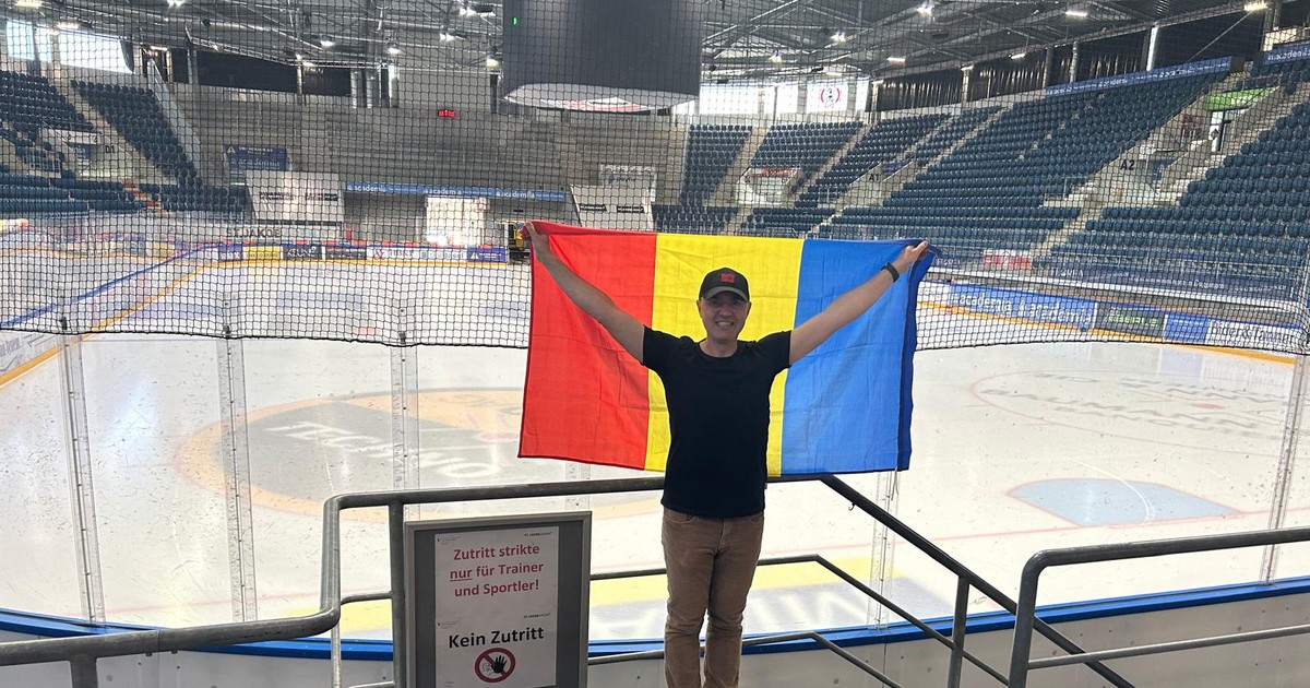 Cornel Gheorghe, fluturând steagul tricolor, pe St. Jakob Arena din Basel