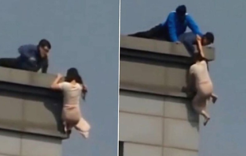 O femeie care a vrut să se arunce de pe un zgârie-nori din Seul a fost salvată de pompieri după 2 ore | VIDEO