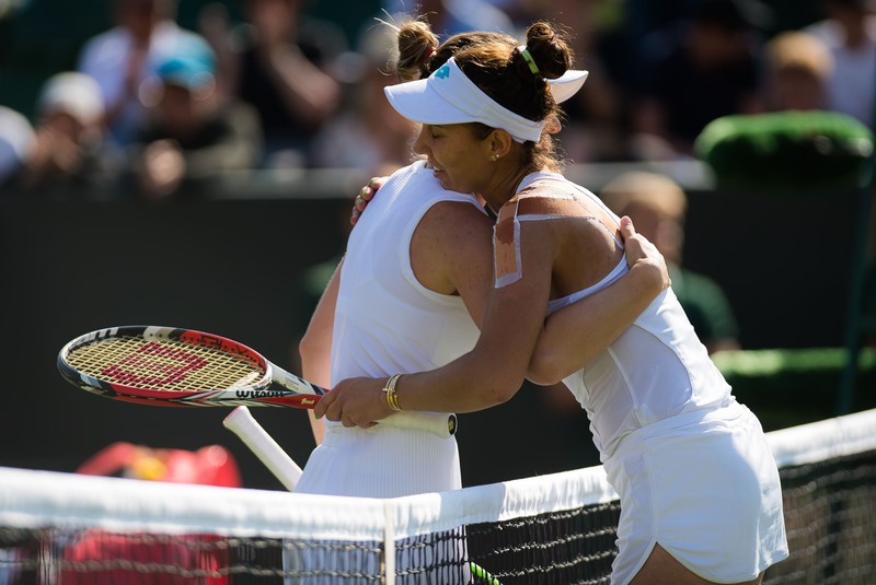 Mihaela Buzarnescu of Romania in action during her second-round match at the 2019 Wimbledon Championships Grand Slam Tennis Tournament against Simona Halep of Romania