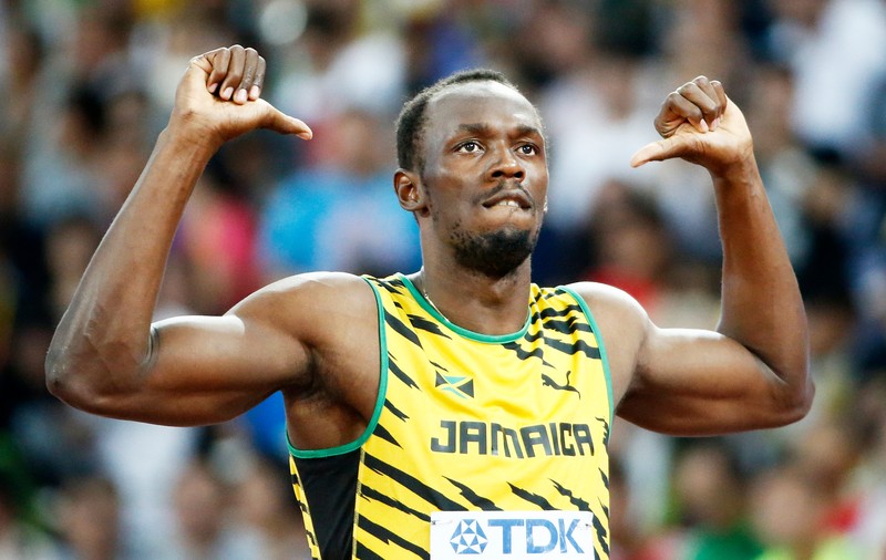 Usain Bolt, obligat să poarte tricoul unui dușman din fotbal