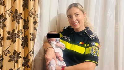 Violeta politista prahova salvat bebelus vecini