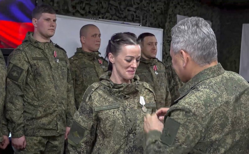 epa10502189 A still image taken from a handout video provided by the Russian Defence Ministry's press service shows Russian Minister of Defence Sergei Shoigu (R) awarding a Russian servicewoman during his inspection of the positions of Russian troops, at an undisclosed location in Ukraine, 04 March 2023. Russias Defense Ministry said that Shoigu inspected the forward command post of a unit of the 'Vostok' forces in the south Donetsk direction, working in the zone of the special military operation, adding that the chief of defense visit focused on the organization of comprehensive support for troops, including conditions for the safe deployment of personnel, as well as the inspection of work of medical and rear units. EPA-EFE/RUSSIAN DEFENCE MINISTRY PRESS SERVICE/HANDOUT HANDOUT EDITORIAL USE ONLY/NO SALES HANDOUT EDITORIAL USE ONLY/NO SALES
