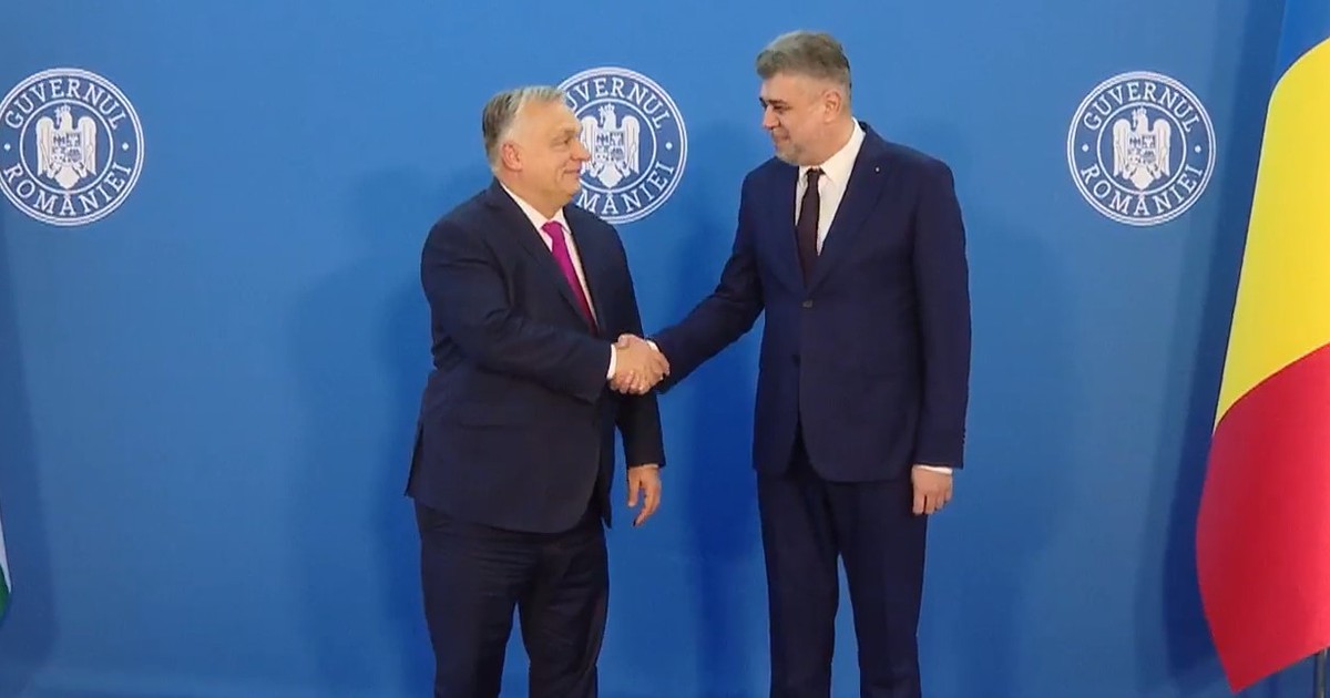 viktor orban dând mâna cu Marcel Ciolacu