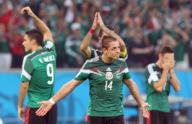 epa04276368 Mexican players (C: Javier Hernandez of Mexico) react after the FIFA World Cup 2014 group A preliminary round match between Croatia and Mexico at the Arena Pernambuco in Recife, Brazil, 23 June 2014. (RESTRICTIONS APPLY: Editorial Use Only, not used in association with any commercial entity - Images must not be used in any form of alert service or push service of any kind including via mobile alert services, downloads to mobile devices or MMS messaging - Images must appear as still images and must not emulate match action video footage - No alteration is made to, and no text or image is superimposed over, any published image which: (a) intentionally obscures or removes a sponsor identification image; or (b) adds or overlays the commercial identification of any third party which is not officially associated with the FIFA World Cup) EPA/SRDJAN SUKI EDITORIAL USE ONLY