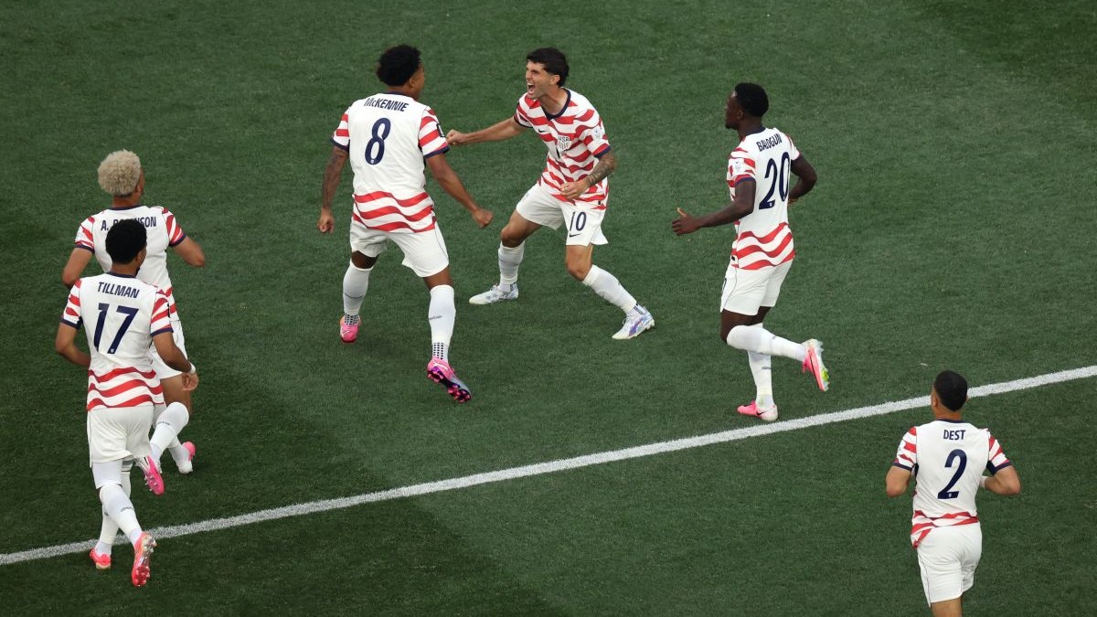 INGLEWOOD, CALIFORNIA - JUNE 12: Christian Pulisic #10 and Weston McKennie #8 of the United States celebrate their side's first goal, an own goal by Damian Bobadilla #16 of Paraguay (not pictured), during the FIFA World Cup 2026 Group D match between USA and Paraguay at Los Angeles Stadium on June 12, 2026 in Inglewood, California. (Photo by Harry How/Getty Images)