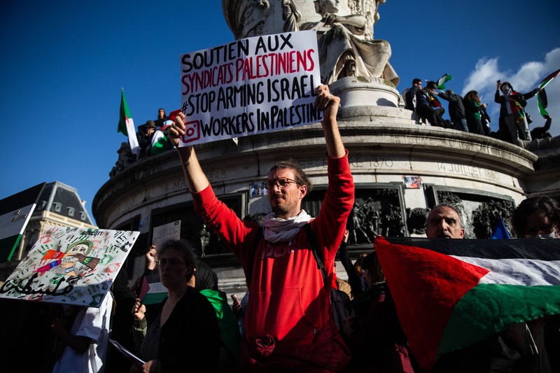 PARIS, FRANCE - OCTOBER 22: Protesters, holding banners, participate in a demonstration to show solidarity with Palestinian people near the Place de la Republique in Paris, France, on October 22, 2023. Ibrahim Ezzat / Anadolu