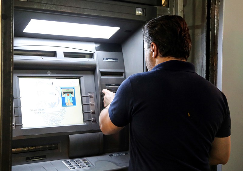 According to DIICOT, the defendants skimmed money from cards in the USA and the operations were coordinated from Romania. Photo: EPA&nbsp;