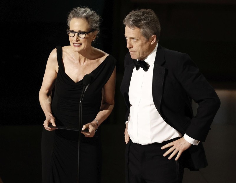 epa10518844 Andie McDowell and Hugh Grant during the 95th annual Academy Awards ceremony at the Dolby Theatre in Hollywood, Los Angeles, California, USA, 12 March 2023. The Oscars are presented for outstanding individual or collective efforts in filmmaking in 24 categories. EPA-EFE/ETIENNE LAURENT