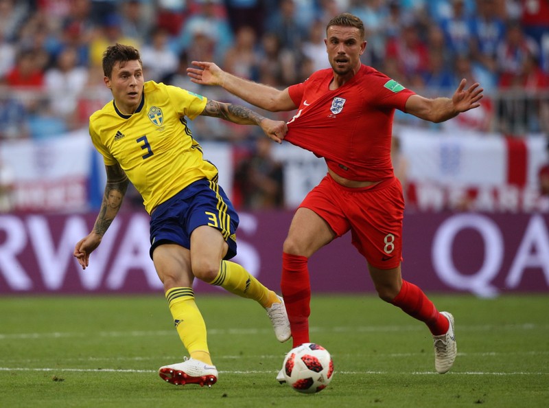 07.07.2018 Sweden's Victor Lindelof, left, and England's Jordan Henderson struggle for a ball during the World Cup quarterfinal soccer match between Sweden and England at the Samara Arena, in Samara, Russia, July 7, 2018. Vitaliy Timkiv / Sputnik