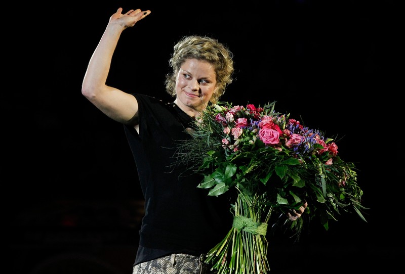 epa03506425 Former world number one Kim Clijsters waves to the crowd during the Kim's Thank You Games at the Sportpaleis, in Antwerp, Belgium, 12 December 2012. Kim Clijsters played her farewell single match against U.S. Venus William during a show celebrating her career. EPA/THIERRY ROGE