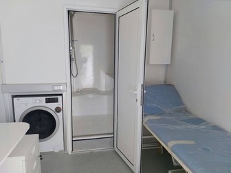 Mașină de spălat cu uscător, duș și spațiu pentru control medical