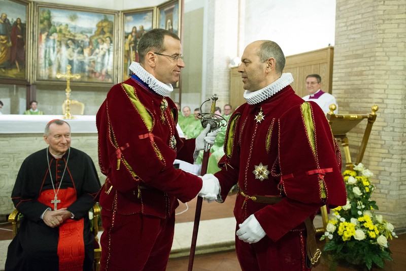 In this undated photo Col. Daniel Anrig, left, shakes hands with Lt. Col. Christoph Graf. The Vatican announced Saturday, Feb. 7, 2015. that Pope Francis has promoted the No. 2 officer of the Swiss Guards to commander of the colorful, 500-year-old army, whose members take an oath to protect pontiffs. Graf, who joined the Guards in 1987, takes the place of Col. Daniel Anrig, who had been commander since 2008. (AP Photo/L'Osservatore Romano, pool)