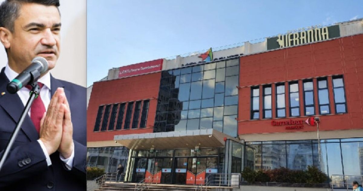 coloaj foto cu mihai chirica, primarul iasului, si mall-ul iesean veranda, o cladire moderna cu caramida rosie si sticla