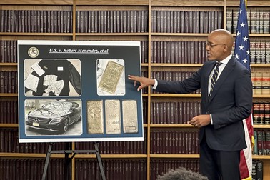 Damian Williams, U.S. Attorney for the Southern District of New York, talks about a display of photos of evidence in an indictment against Sen. Bob Menendez during a news conference, Friday, Sept. 22, 2023, in New York. Menendez of New Jersey and his wife have been indicted on charges of bribery.,Image: 807497431, License: Rights-managed, Restrictions: This content is intended for editorial use only. For other uses, additional clearances may be required., Model Release: no, Pictured: Robert Menendez