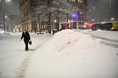 Femeie cu mască în Stockholm, februarie 2021 Foto: Epa