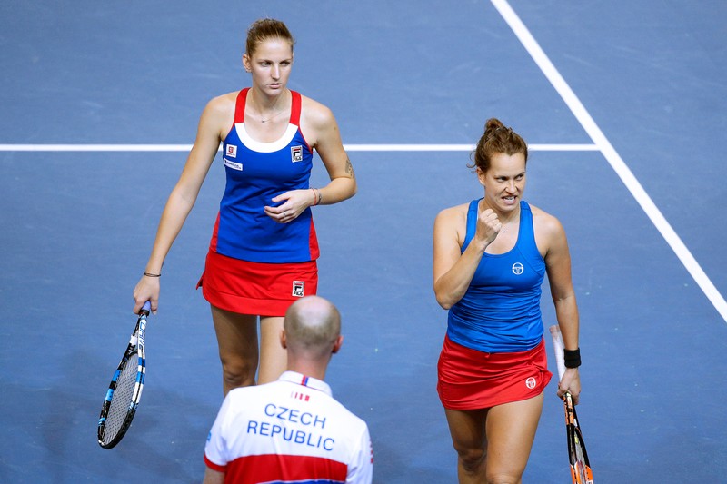 epa05630249 Barbora Strycova (R) and Karolina Pliskova (L) of the Czech Republic react during their doubles match against Caroline Garcia and Kristina Mladenovic of France at the Fed Cup Tennis World Group final between France and the Czech Republic at the Rhenus Sport stadium in Strasbourg, France, 13 November 2016. EPA/YOAN VALAT