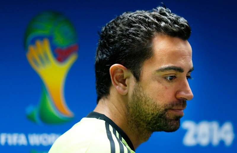 epa04252126 Spanish national soccer team midfielder Xavi Hernandez attends a press conference at the Arena Fonte Nova stadium in Salvador, Brazil, 12 June 2014. Spain will face the Netherlands in their preliminary round Group B match of the FIFA World Cup 2014 on 13 June 2014 in Salvador. (RESTRICTIONS APPLY: Editorial Use Only, not used in association with any commercial entity - Images must not be used in any form of alert service or push service of any kind including via mobile alert services, downloads to mobile devices or MMS messaging - Images must appear as still images and must not emulate match action video footage - No alteration is made to, and no text or image is superimposed over, any published image which: (a) intentionally obscures or removes a sponsor identification image; or (b) adds or overlays the commercial identification of any third party which is not officially associated with the FIFA World Cup) EPA/GUILLAUME HORCAJUELO EDITORIAL USE ONLY