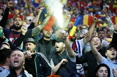 epa05377866 Romanian fans at the start of the UEFA EURO 2016 group A preliminary round match between Romania and Albania at Stade de Lyon in Lyon, France, 19 June 2016. (RESTRICTIONS APPLY: For editorial news reporting purposes only. Not used for commercial or marketing purposes without prior written approval of UEFA. Images must appear as still images and must not emulate match action video footage. Photographs published in online publications (whether via the Internet or otherwise) shall have an interval of at least 20 seconds between the posting.) EPA/SERGEY DOLZHENKO EDITORIAL USE ONLY