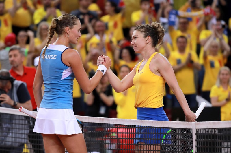 epa07517688  Simona Halep (R) of Romania shakes hand with Kristina Mladenovic (L) of France after winning the game during the Fed Cup World Group, Semi Final between France and Romania, in Rouen, France, 20 April 2019 EPA-EFE/CHRISTOPHE PETIT TESSON