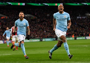 epa06565088 Manchester City's Vincent Kompany (R) celebrates scoring the 2-0 goal during the English League Cup Final between Manchester City and Arsenal FC at Wembley Stadium, London, Britain, 25 February 2018. EPA-EFE/NEIL HALL EDITORIAL USE ONLY. No use with unauthorized audio, video, data, fixture lists, club/league logos or 'live' services. Online in-match use limited to 75 images, no video emulation. No use in betting, games or single club/league/player publications.