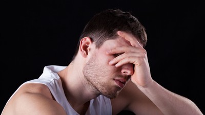 27747178 - a closeup of a young handsome miserable and tired man