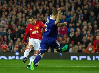 epa05917859 Manchester United's Henrikh Mkhitaryan (L) scores the opening goal during the UEFA Europa League quarter final , second leg, soccer match between Manchester United and RSC Anderlecht at Old Trafford in Manchester, Britain, 20 March 2017. EPA/PETER POWELL