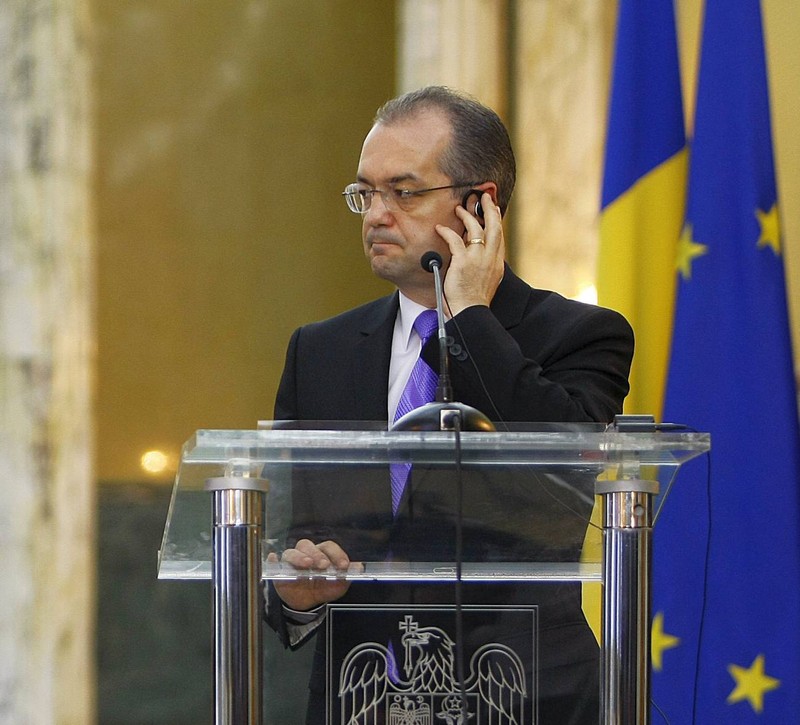 German Chancellor Angela Merkel with Romanian Prime Minister Emil Boc, during the ceremony at Victoria Palace in Bucharest, Romania, 12 October 2010.