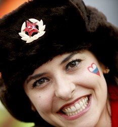 epa04284205 Supporter of Russia cheers proir to the FIFA World Cup 2014 group H preliminary round match between Algeria and Russia at the Arena da Baixada in Curitiba, Brazil, 26 June 2014. (RESTRICTIONS APPLY: Editorial Use Only, not used in association with any commercial entity - Images must not be used in any form of alert service or push service of any kind including via mobile alert services, downloads to mobile devices or MMS messaging - Images must appear as still images and must not emulate match action video footage - No alteration is made to, and no text or image is superimposed over, any published image which: (a) intentionally obscures or removes a sponsor identification image; or (b) adds or overlays the commercial identification of any third party which is not officially associated with the FIFA World Cup) EPA/RUNGROJ YONGRIT EDITORIAL USE ONLY