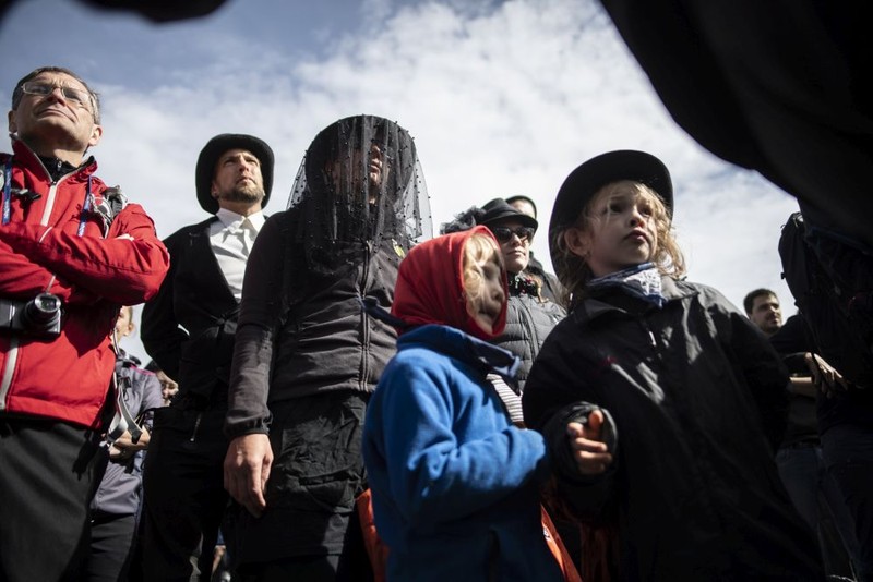 epa07861166 People in black clothing attend a commemoration for the dying glacier of Pizol mountain, in Wangs, Switzerland, 22 September 2019. Various organizations gathered to shine a light on climate change and melting glaciers. EPA-EFE/GIAN EHRENZELLER ATTENTION: This Image is part of a PHOTO SET