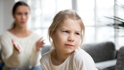 Sulky angry offended kid girl pouting ignoring mother scolding h