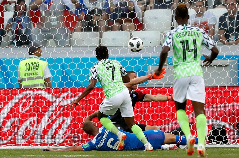 epa06831331 Ahmed Musa (L) of Nigeria celebrates scoring the opening goal during the FIFA World Cup 2018 group D preliminary round soccer match between Nigeria and Iceland in Volgograd, Russia, 22 June 2018. (RESTRICTIONS APPLY: Editorial Use Only, not used in association with any commercial entity - Images must not be used in any form of alert service or push service of any kind including via mobile alert services, downloads to mobile devices or MMS messaging - Images must appear as still images and must not emulate match action video footage - No alteration is made to, and no text or image is superimposed over, any published image which: (a) intentionally obscures or removes a sponsor identification image; or (b) adds or overlays the commercial identification of any third party which is not officially associated with the FIFA World Cup) EPA-EFE/SERGEI ILNITSKY EDITORIAL USE ONLY