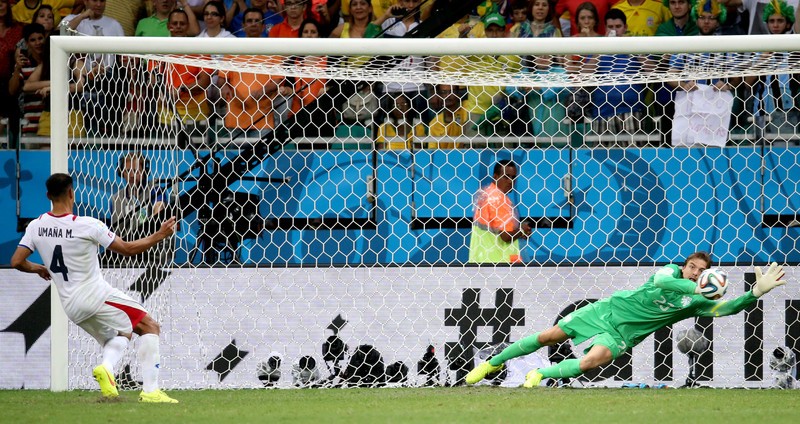epa04301960 Dutch goalkeeper Tim Krul (R) saves a penalty kick by Michael Umana of Costa Rica during the penalty shoot out during the FIFA World Cup 2014 quarter final match between the Netherlands and Costa Rica at the Arena Fonte Nova in Salvador, Brazil, 05 July 2014. (RESTRICTIONS APPLY: Editorial Use Only, not used in association with any commercial entity - Images must not be used in any form of alert service or push service of any kind including via mobile alert services, downloads to mobile devices or MMS messaging - Images must appear as still images and must not emulate match action video footage - No alteration is made to, and no text or image is superimposed over, any published image which: (a) intentionally obscures or removes a sponsor identification image; or (b) adds or overlays the commercial identification of any third party which is not officially associated with the FIFA World Cup) EPA/ALI HAIDER EDITORIAL USE ONLY
