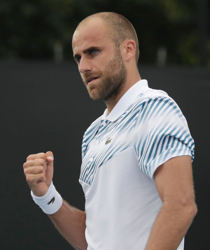 epa07285354 Marius Copil of Romania celebrates his win in his round one men's singles match against Marcel Granollers of Spain on day two of the Australian Open Grand Slam tennis tournament in Melbourne, Australia, 15 January 2019. EPA-EFE/LYNN BO BO