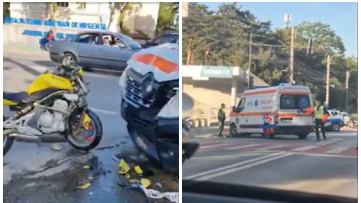 În imagine se vede un accident rutier în care un motociclist a intrat în coliziune cu o ambulanță, rezultând avarii semnificative la ambele vehicule. La fața locului sunt prezenți polițiști care dirijează traficul, iar ambulanța este oprită în mijlocul drumului.