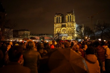 Spectators gather outside France's iconic Notre Dame Cathedral Saturday, Dec. 7, 2024 in Paris for it's formal reopening for the first time since a devastating fire nearly destroyed the 861-year-old landmark in 2019.,Image: 944103511, License: Rights-managed, Restrictions: This content is intended for editorial use only. For other uses, additional clearances may be required., Model Release: no