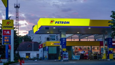 Bucharest, Romania - June 22, 2022: A Petrom gas station is seen at night in Bucharest Editorial stock photo - stock image