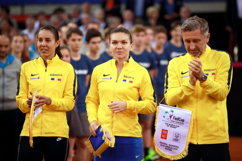 epa07517324 (L to R) Mihaela Buzarnescu, Simona Halep and Florin Segarceanu, headcoach of Romania pose prior to the Fed Cup World Group, Semi Final between France and Romania, in Rouen, France, 20 April 2019. EPA-EFE/CHRISTOPHE PETIT TESSON