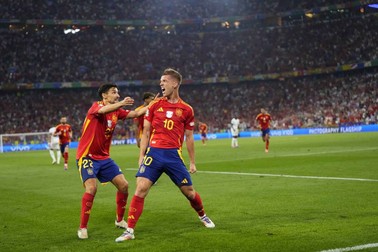 Spain's Dani Olmo celebrates with his teammate Spain's goalkeeper Unai Simon after scoring his side's second goal during a semifinal match between Spain and France at the Euro 2024 soccer tournament in Munich, Germany, Tuesday, July 9, 2024.,Image: 888559474, License: Rights-managed, Restrictions: This content is intended for editorial use only. For other uses, additional clearances may be required., Model Release: no, Pictured: Dani Olmo