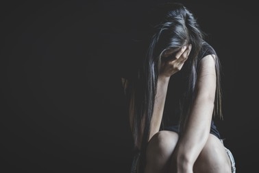 depressed woman sitting in the corner of the room and feeling fear violence from harassment, domestic and rape violence, beaten and raped sitting in the corner, Copy space.